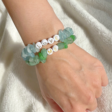 Load image into Gallery viewer, Girl wearing aquamarine and aventurine bracelets with personalised LOVE and ME beads
