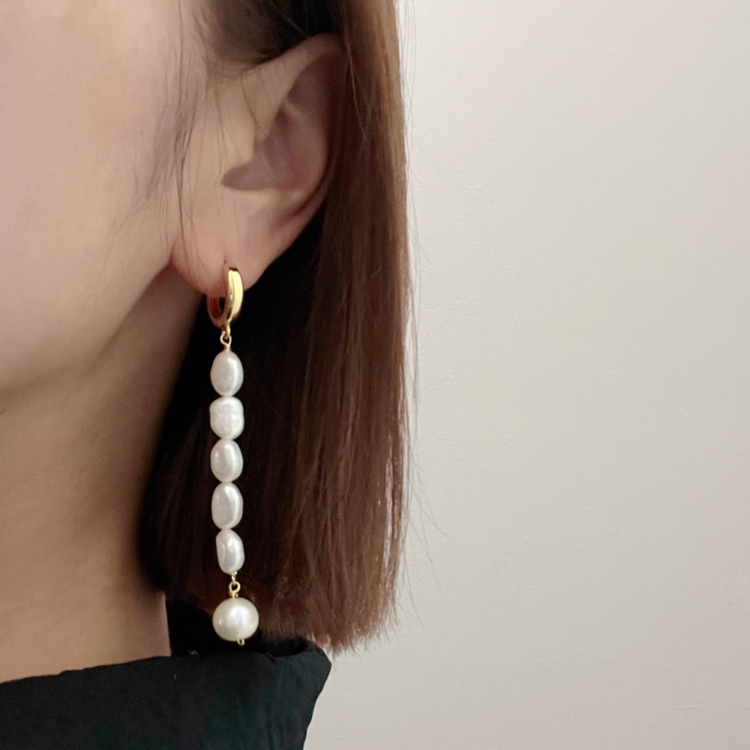 Girl Wearing Adına Long Pearl Earrings by Debbie Debster