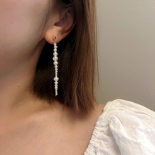 Load image into Gallery viewer, Girl wearing handmade earrings by Debbie Debster with freshwater pearls
