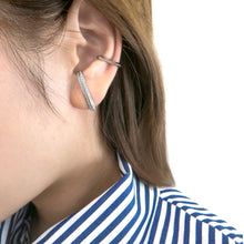 Load image into Gallery viewer, Sleek &amp; modern curved earrings wrap around wearer&#39;s ear. 
